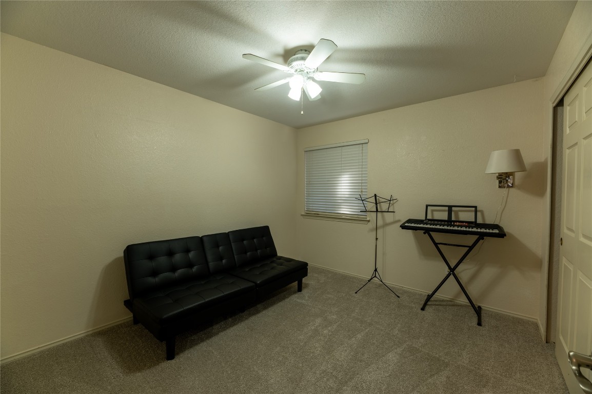 2604 Hutton Lane Leander, TX 78641 - Photo 17 of 27 a living room with furniture and a ceiling fan