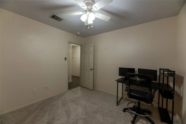 a view of a workspace with furniture