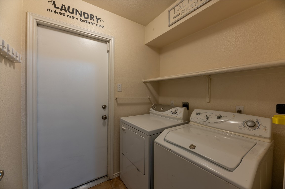 2604 Hutton Lane Leander, TX 78641 - Photo 21 of 27 a utility room with dryer and washer
