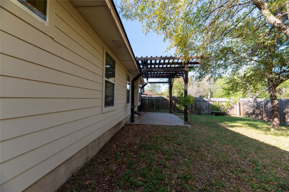 2604 Hutton Lane Leander, TX 78641 - Photo 24 of 27 a view of a backyard with pathway