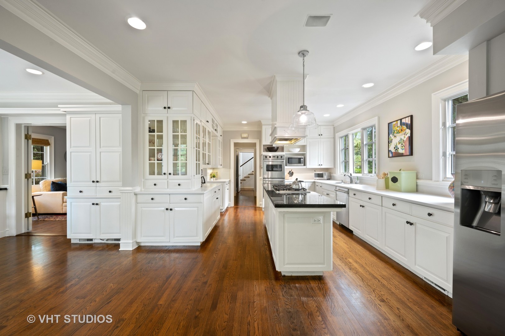 1010 Chestnut Avenue Wilmette, IL 60091 - Photo 14 of 48 a large kitchen with stainless steel appliances sink microwave and wooden floor