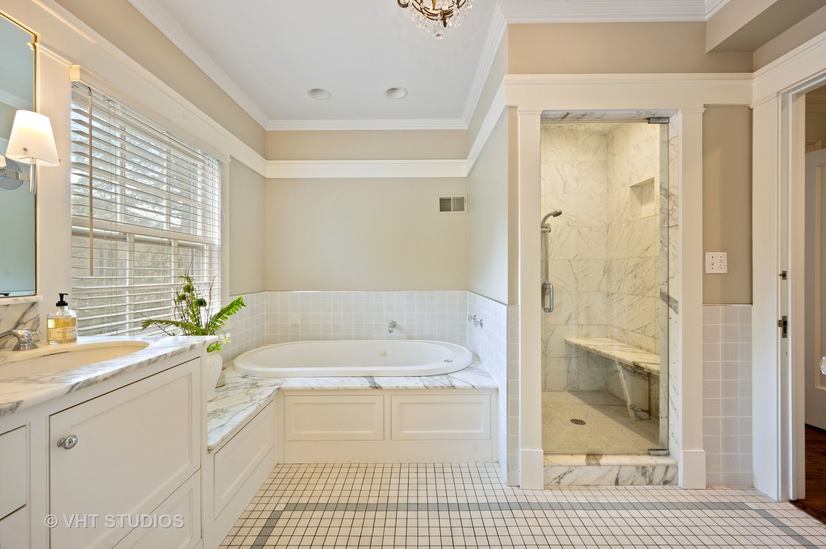 1010 Chestnut Avenue Wilmette, IL 60091 - Photo 23 of 48 a bathroom with a granite countertop bathtub a sink and a shower