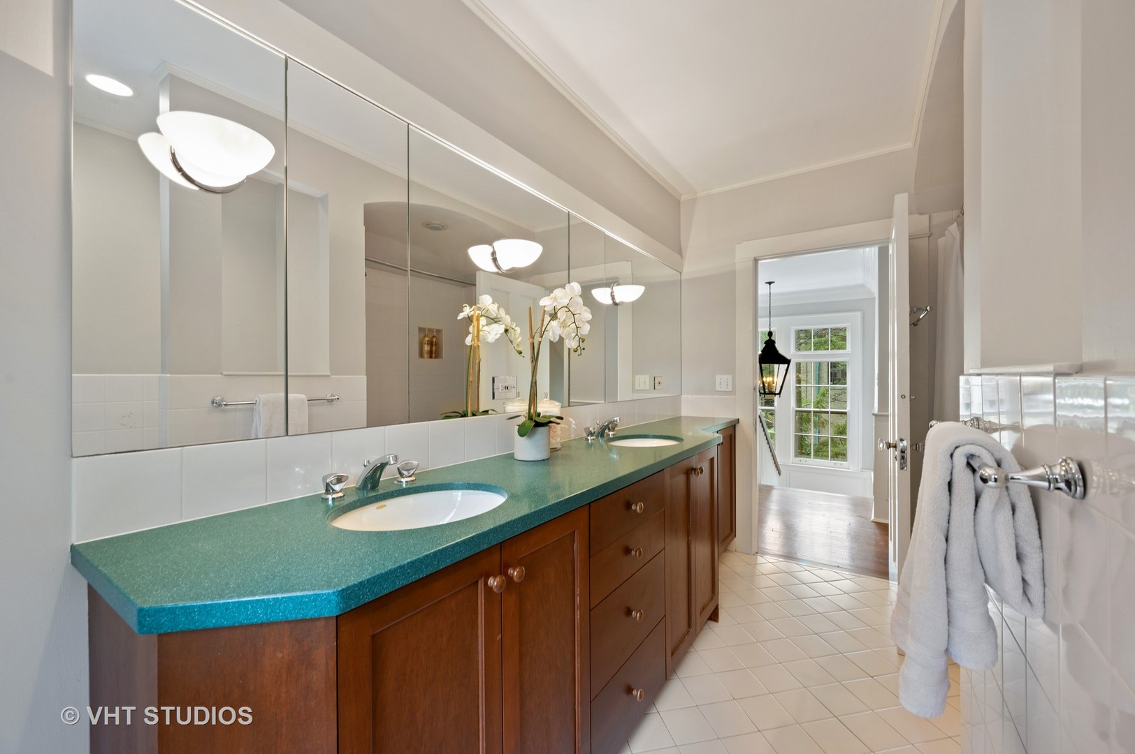 1010 Chestnut Avenue Wilmette, IL 60091 - Photo 29 of 48 a bathroom with a double vanity sink and a mirror