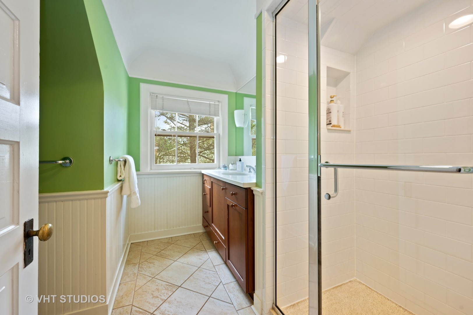 1010 Chestnut Avenue Wilmette, IL 60091 - Photo 33 of 48 a bathroom with a granite countertop shower a mirror and a sink