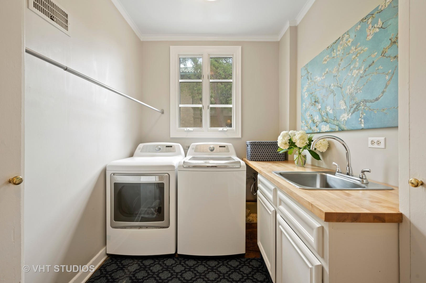 1010 Chestnut Avenue Wilmette, IL 60091 - Photo 36 of 48 a utility room with a sink a washer and dryer