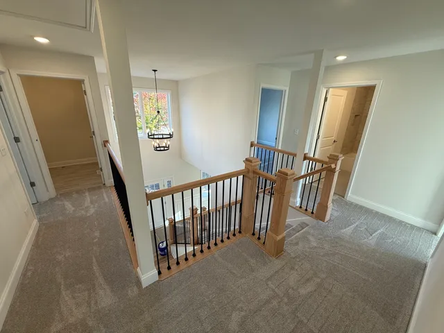 a view of a hallway with windows