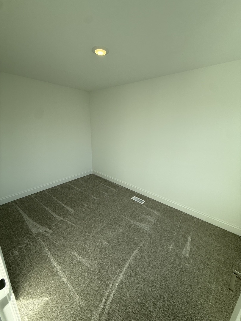 1920 Edmonds Avenue New Lenox, IL 60451 - Photo 22 of 35 an empty room with a workbench