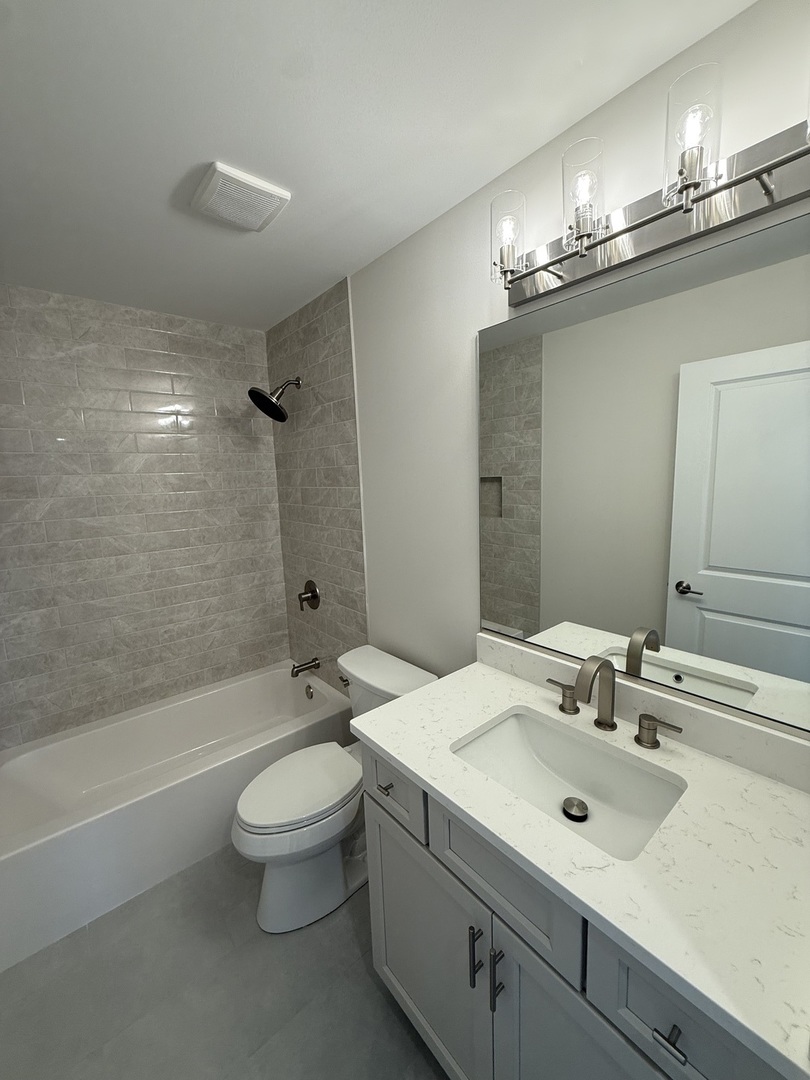 1920 Edmonds Avenue New Lenox, IL 60451 - Photo 26 of 35 a bathroom with a sink a toilet and shower