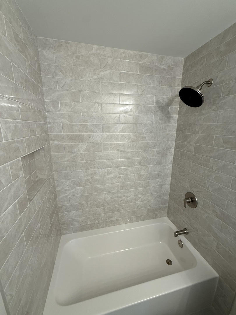 1920 Edmonds Avenue New Lenox, IL 60451 - Photo 27 of 35 a close up of a bathtub in a bathroom