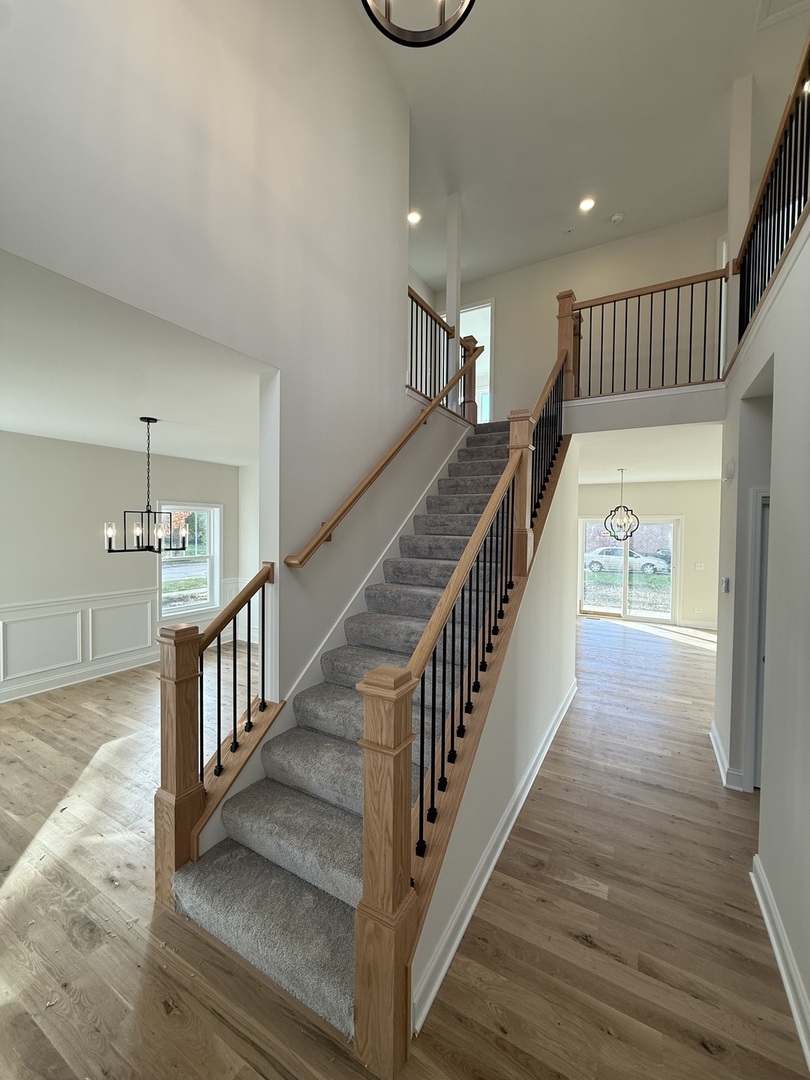 1920 Edmonds Avenue New Lenox, IL 60451 - Photo 30 of 35 a view of staircase with wooden floor and fan