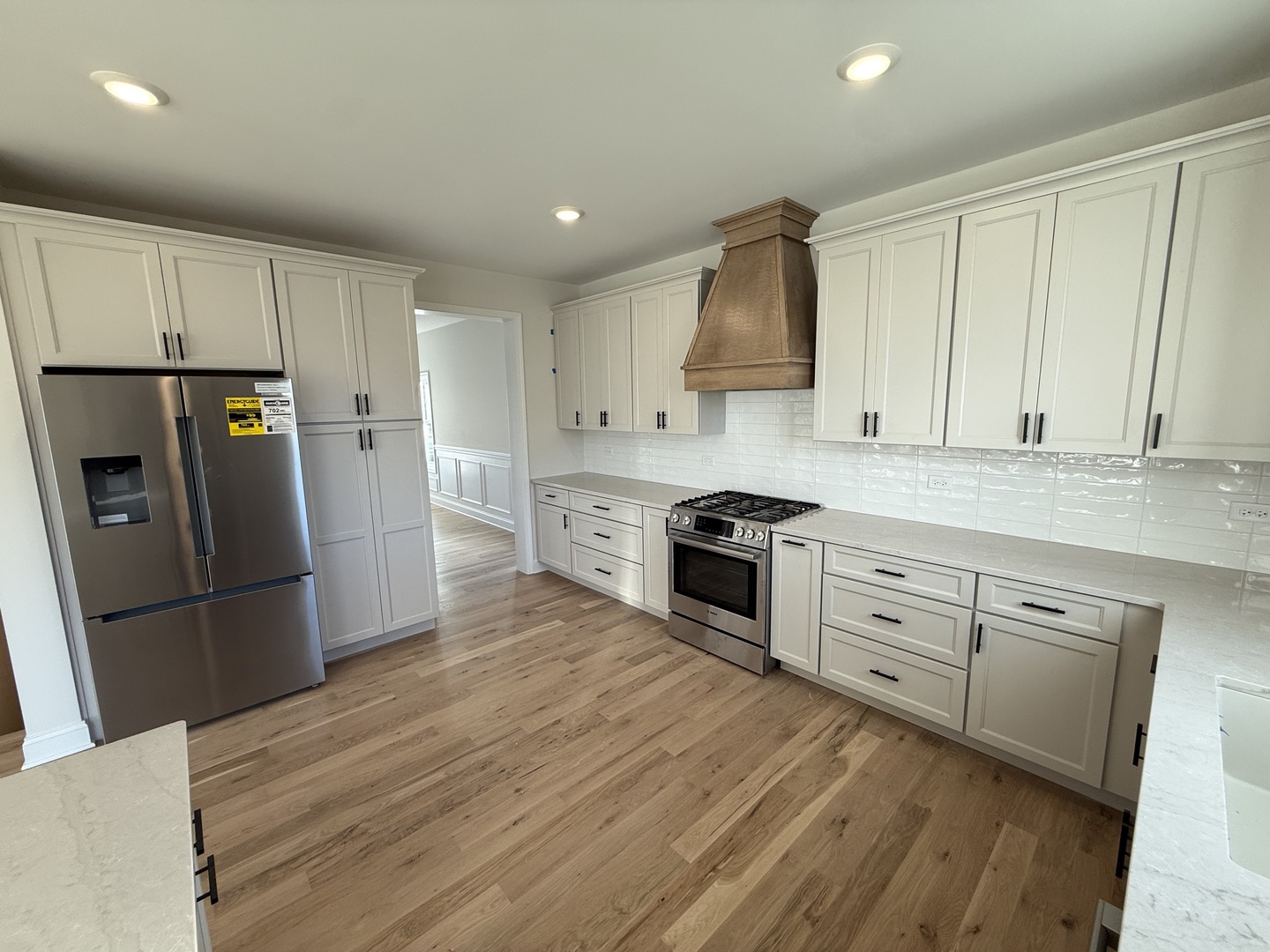 1920 Edmonds Avenue New Lenox, IL 60451 - Photo 6 of 35 a kitchen with granite countertop white cabinets and stainless steel appliances