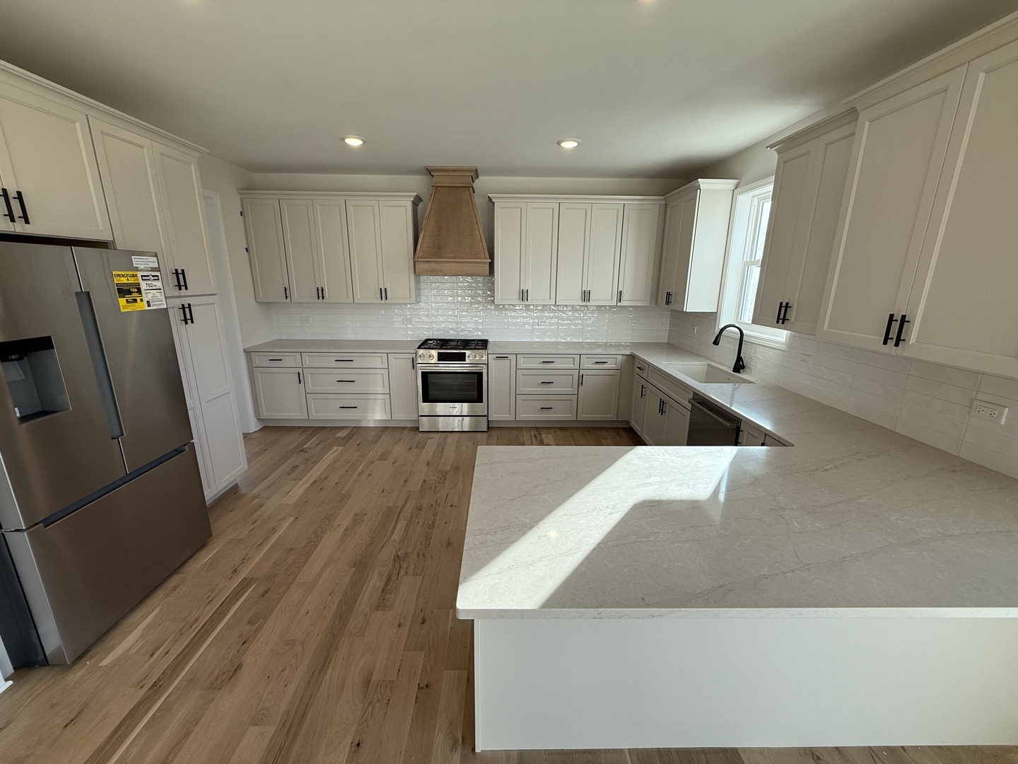 1920 Edmonds Avenue New Lenox, IL 60451 - Photo 9 of 35 a kitchen with stainless steel appliances granite countertop a refrigerator a sink dishwasher a stove and white countertops with wooden floor