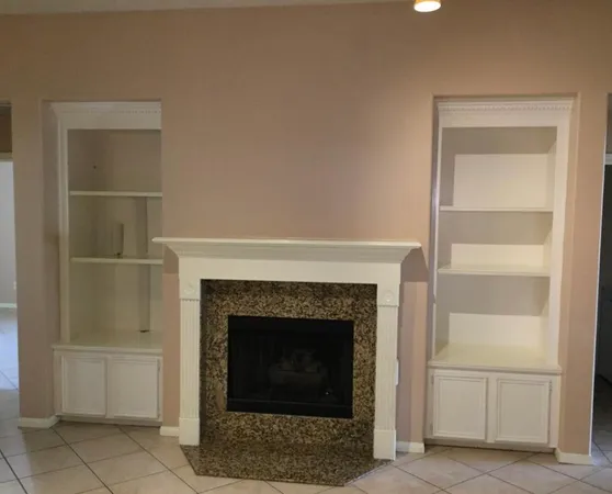 a living room with a fireplace