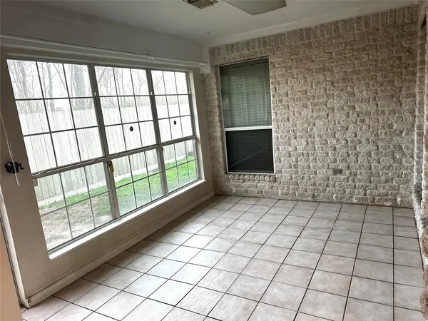 a view of an empty room and window