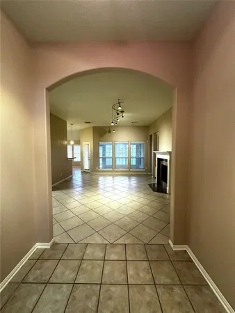 a view of a hallway with a chandelier