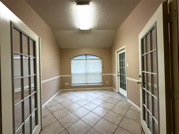 a view of an empty room and window