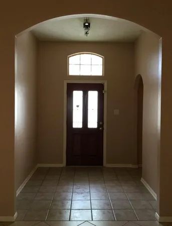 a view of entryway with a front door