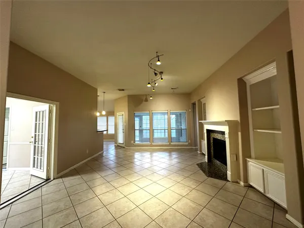 a view of a kitchen with an entryway and a fireplace