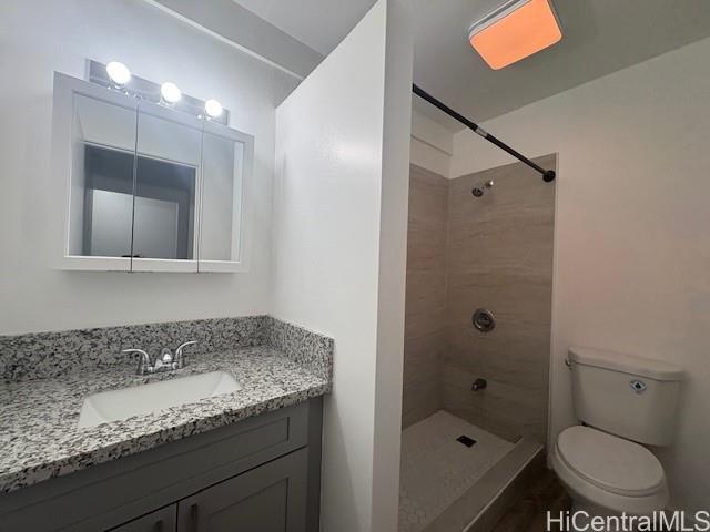 98-1370 Koaheahe Place, Unit 164 Pearl City, HI 96782 - Photo 3 of 12 a bathroom with a granite countertop sink a toilet and shower