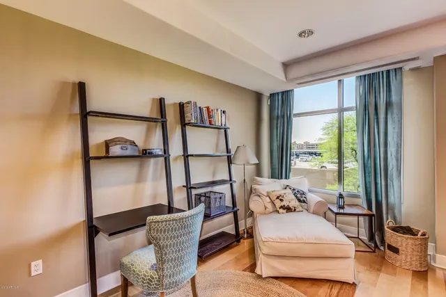 a view of a dining room with furniture wooden floor and a chandelier