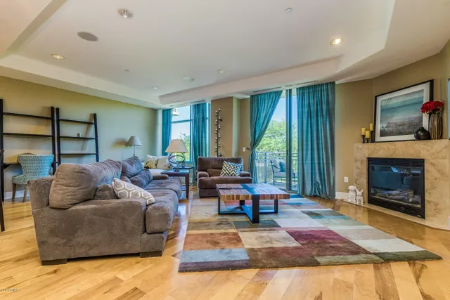 a living room with furniture window and a fireplace
