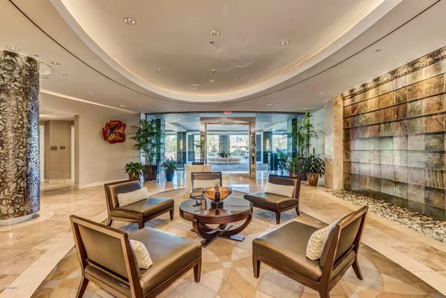 a living room with furniture a window and a table