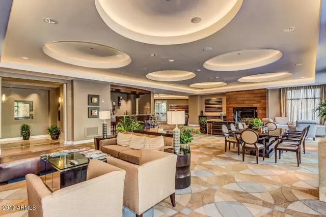 a view of a swimming pool with a table and chairs