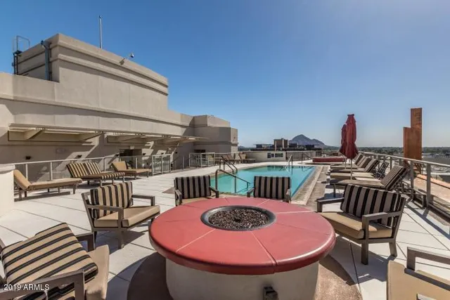 a living room with glass door and furniture