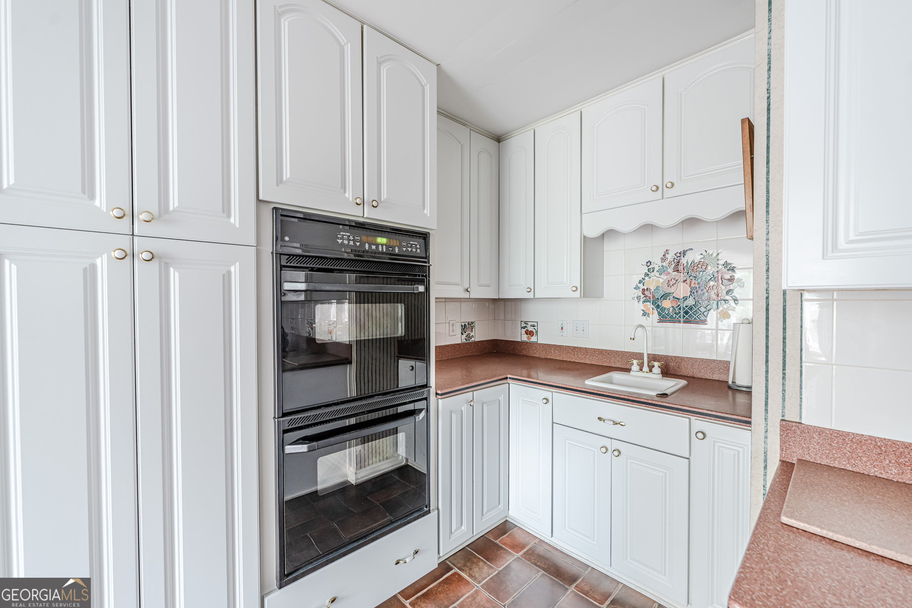 4 Windemere Lane Southeast Rome, GA 30161 - Photo 13 of 60 a kitchen with granite countertop white cabinets and stainless steel appliances