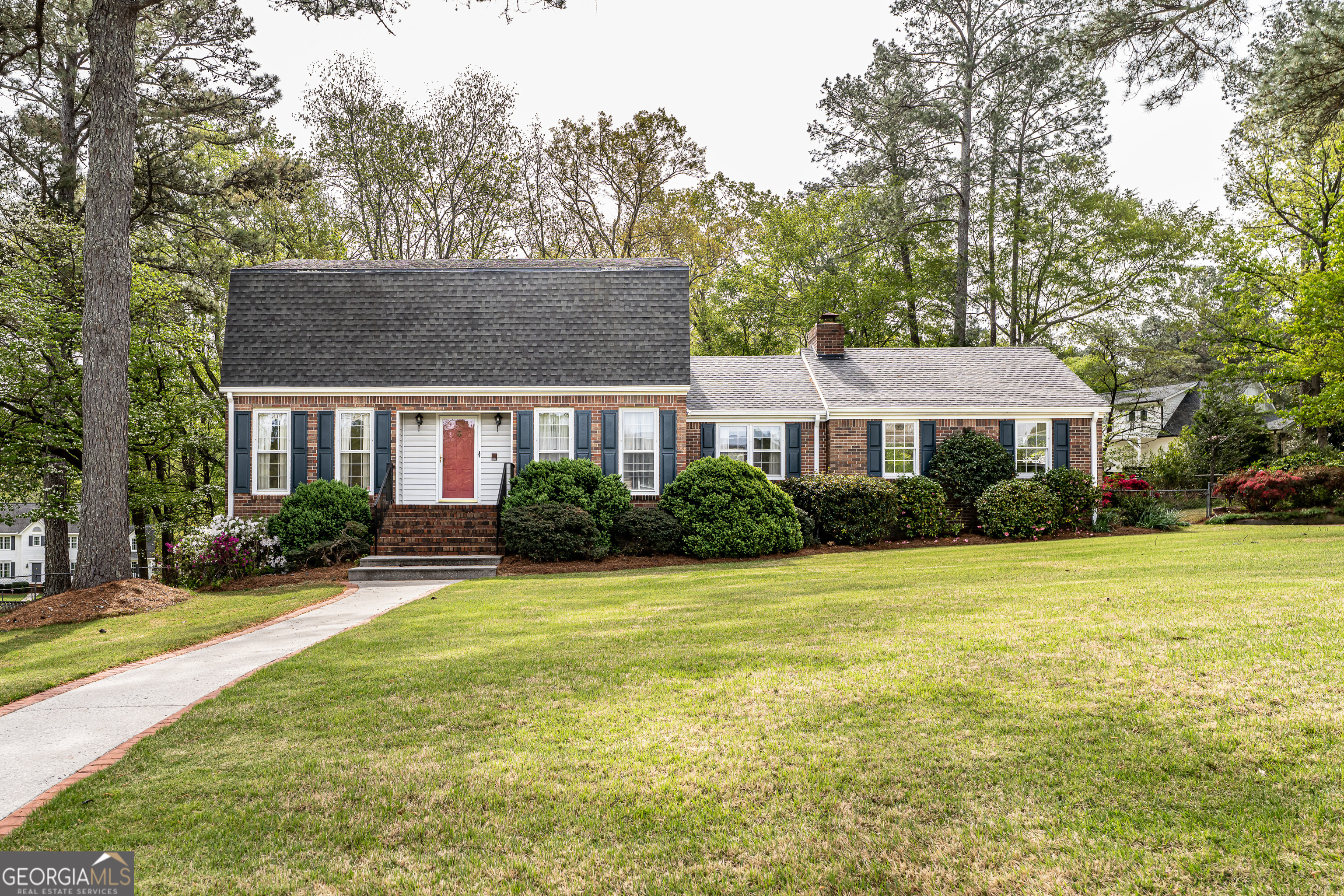 4 Windemere Lane Southeast Rome, GA 30161 - Photo 2 of 60 a front view of a house with a yard and trees