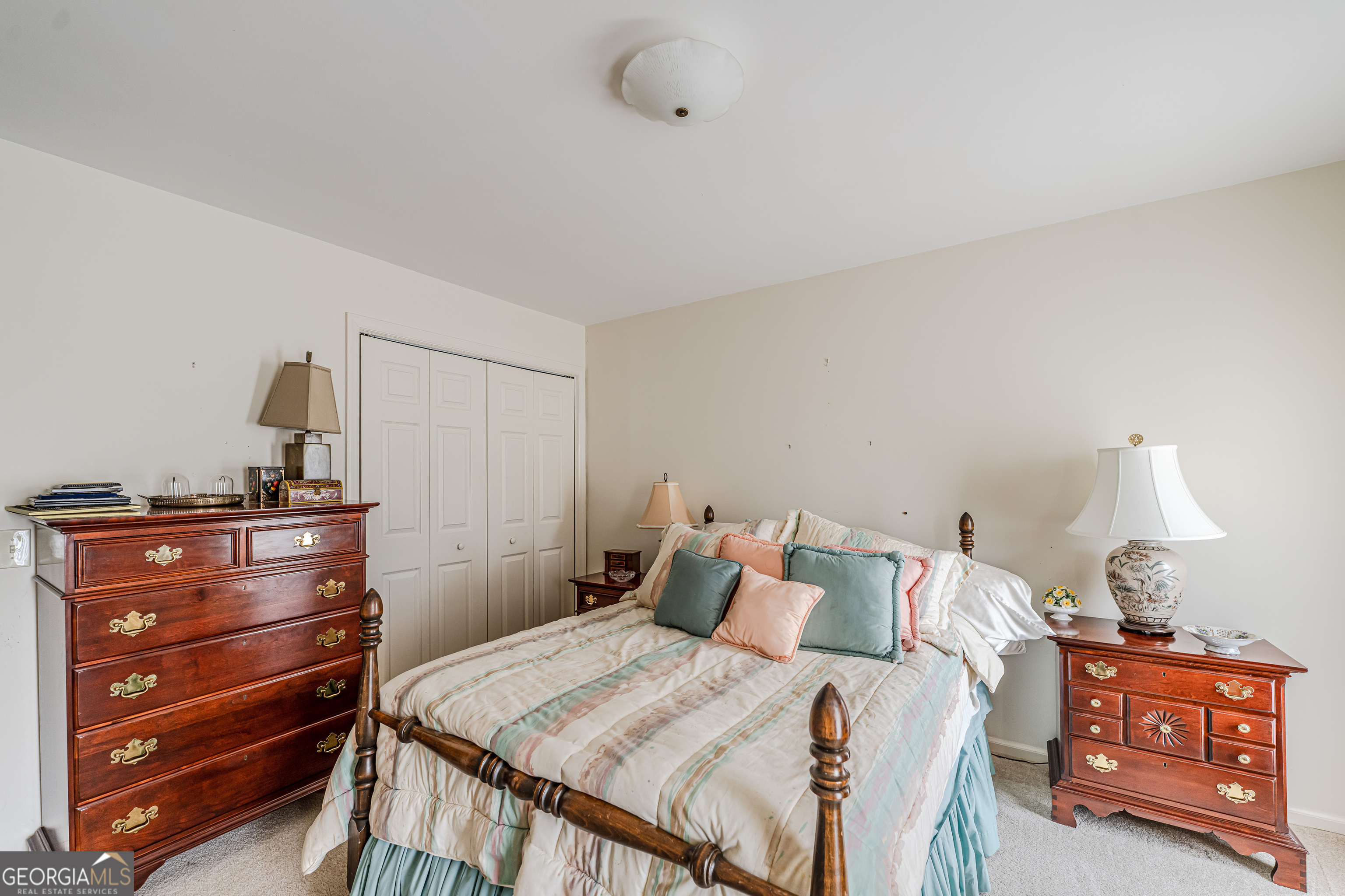 4 Windemere Lane Southeast Rome, GA 30161 - Photo 21 of 60 a bed room with a bed and a lamp on dresser