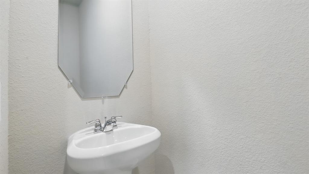 3152 Maple Orch Lane Fort Worth, TX 76140 - Photo 13 of 37 a bathroom with a sink and a mirror