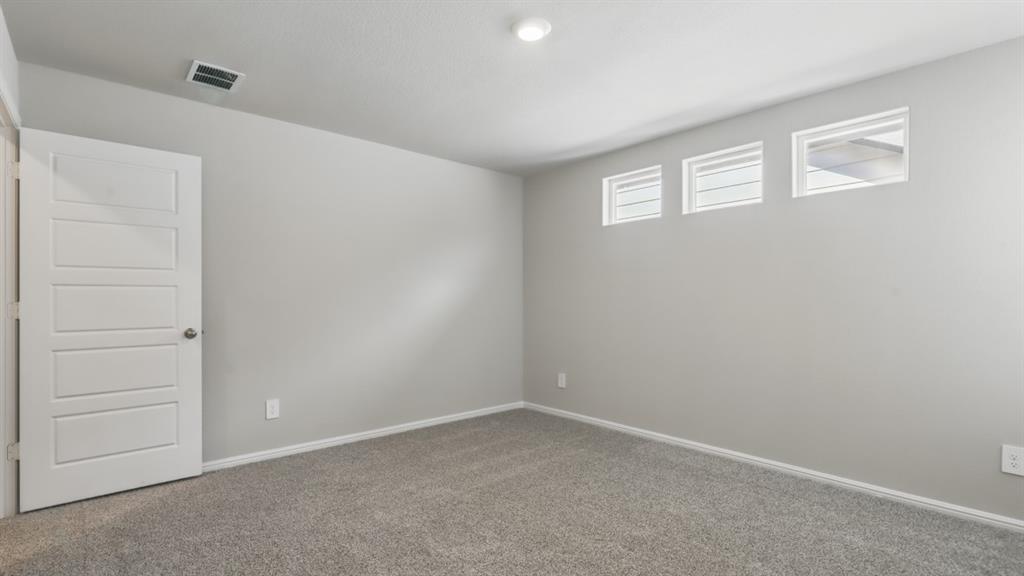 3152 Maple Orch Lane Fort Worth, TX 76140 - Photo 21 of 37 an empty room with windows