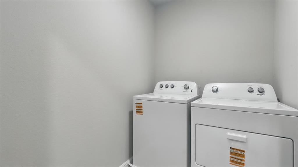 3152 Maple Orch Lane Fort Worth, TX 76140 - Photo 32 of 37 a utility room with dryer and washer