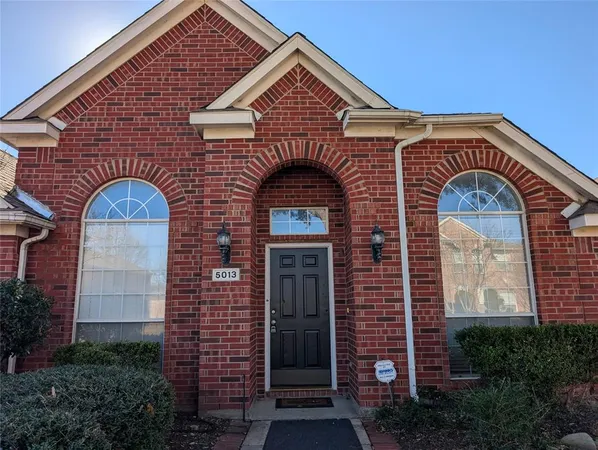 a front view of a house with glass windows