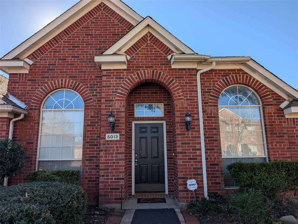 5013 Geranium Court McKinney, TX 75070 - Photo 1 of 11 a front view of a house with glass windows