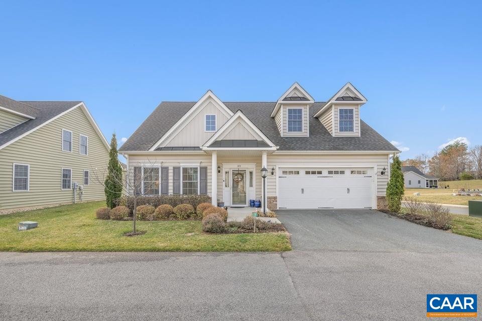 89 Crape Myrtle Drive Palmyra, VA 22963 - Photo 1 of 36 a front view of a house with a yard