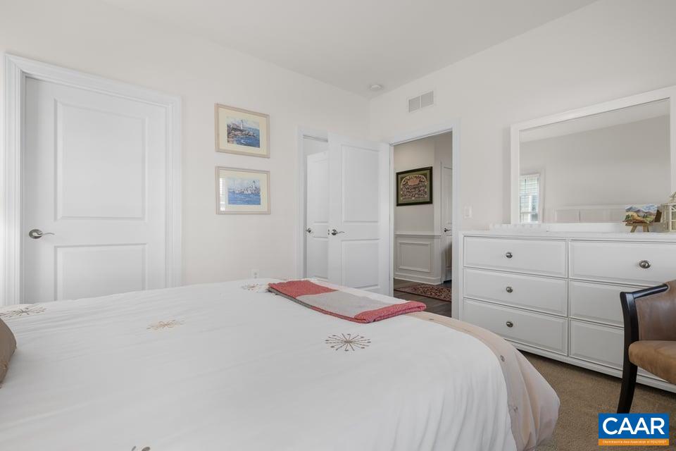 89 Crape Myrtle Drive Palmyra, VA 22963 - Photo 25 of 36 a bedroom with a bed and a view of bathroom