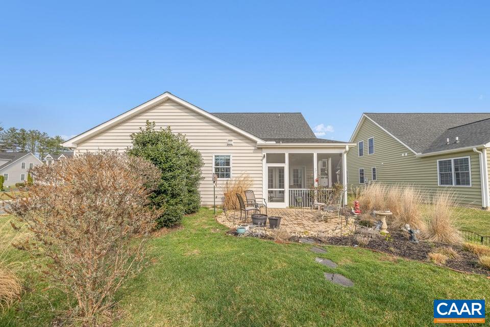 89 Crape Myrtle Drive Palmyra, VA 22963 - Photo 28 of 36 a front view of house with yard and outdoor seating