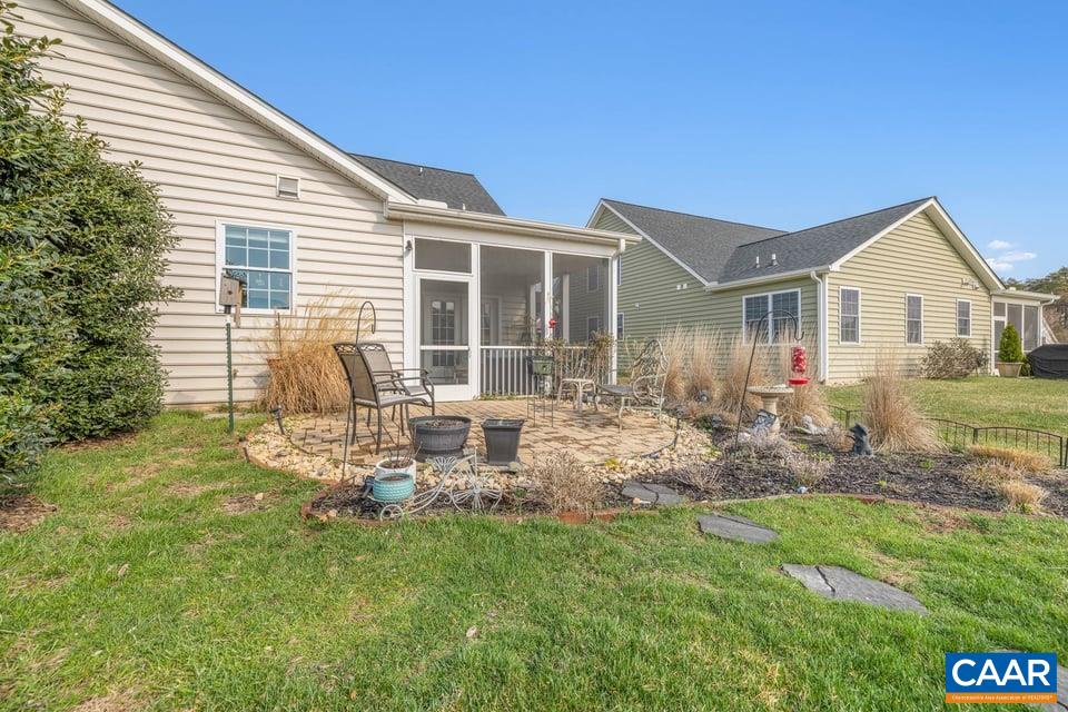 89 Crape Myrtle Drive Palmyra, VA 22963 - Photo 29 of 36 a backyard of a house with table and chairs