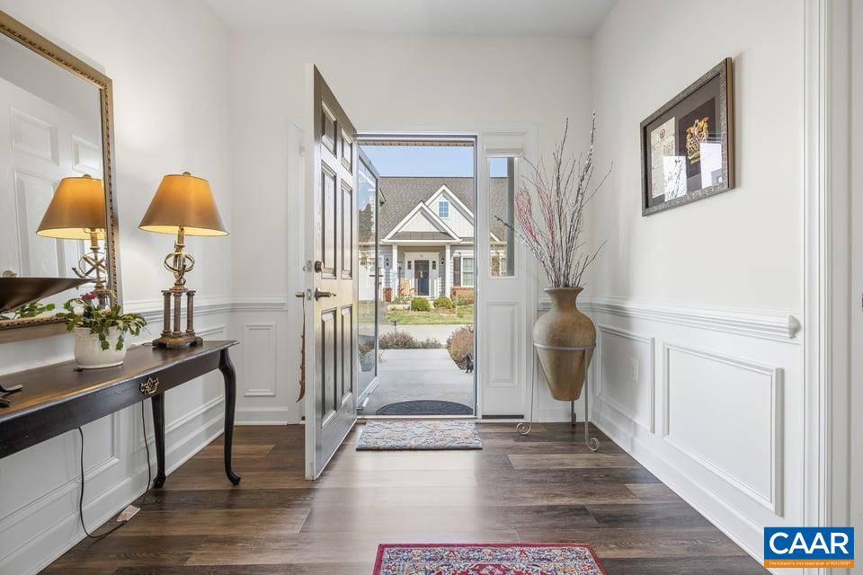 89 Crape Myrtle Drive Palmyra, VA 22963 - Photo 3 of 36 a view of a entryway door and hallway with wooden floor