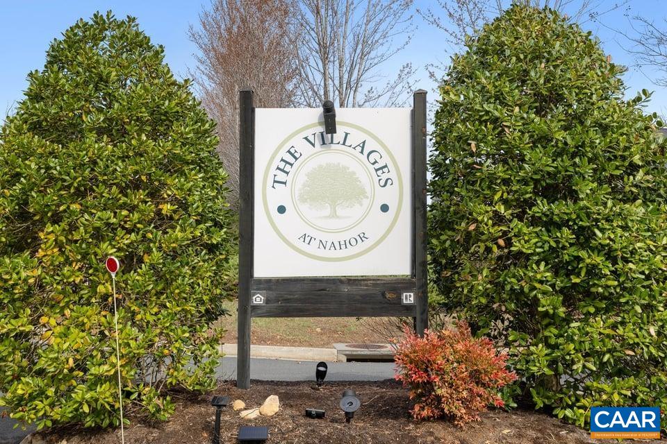 89 Crape Myrtle Drive Palmyra, VA 22963 - Photo 33 of 36 a sign that is sitting on a brick wall