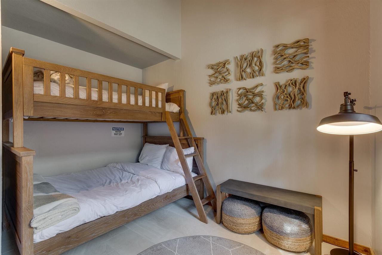 117 Basque Drive Truckee, CA 96161 - Photo 19 of 20 a bedroom with a bed and a table in it