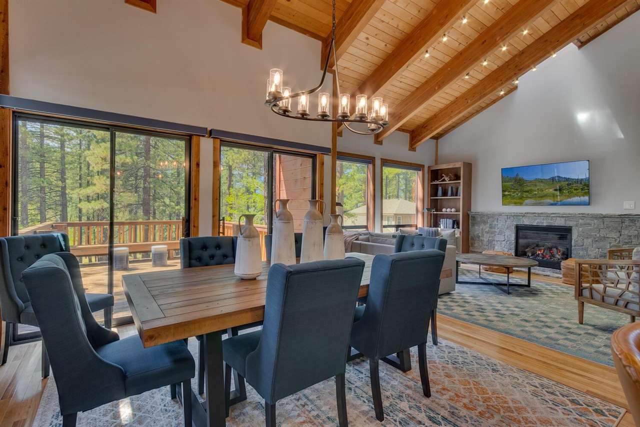117 Basque Drive Truckee, CA 96161 - Photo 5 of 20 a view of a dining room with furniture a chandelier and large windows