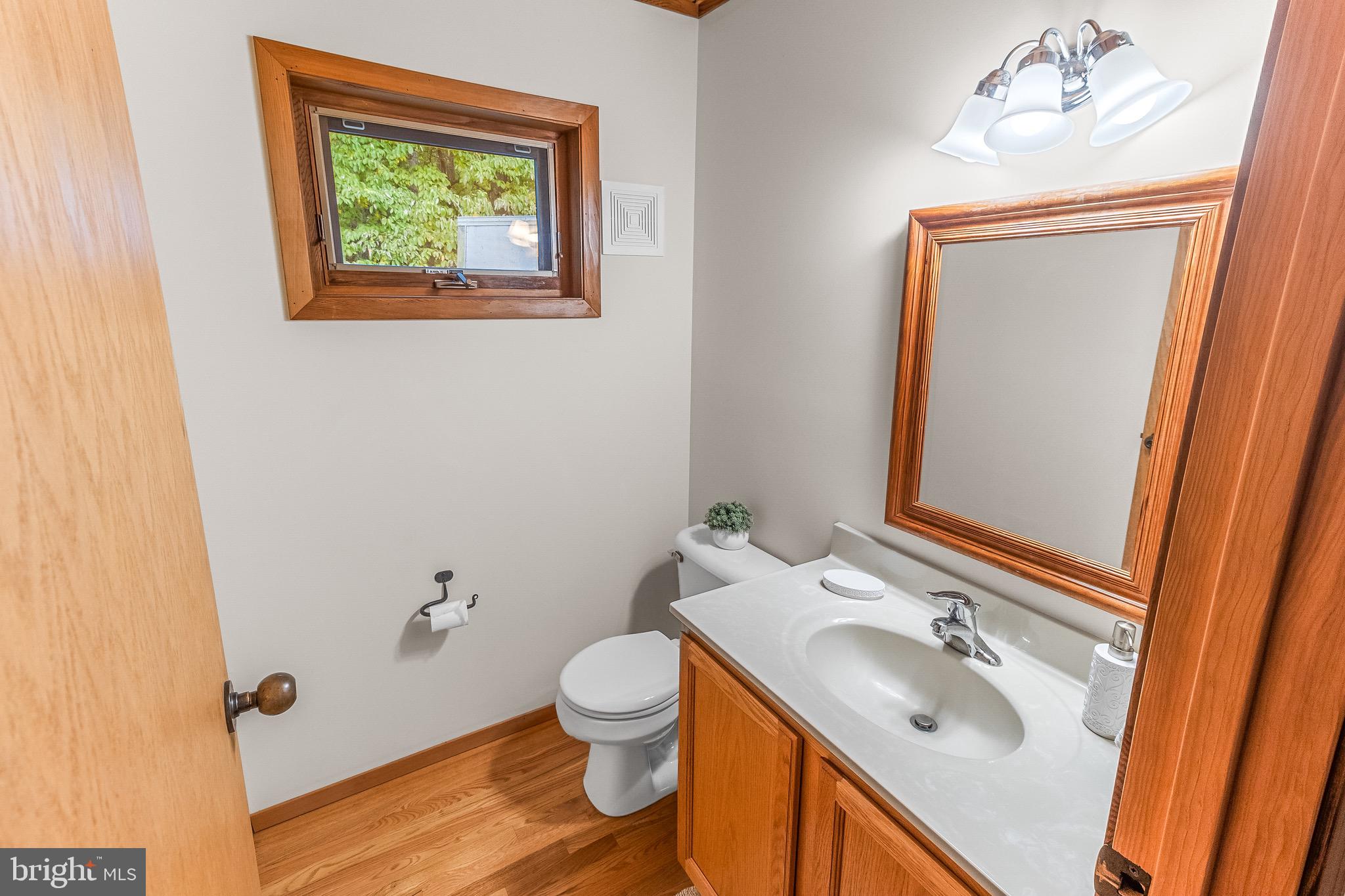 105 Rabbits Rest Lane Shepherdstown, WV 25443 - Photo 23 of 42 a bathroom with a sink mirror vanity and toilet