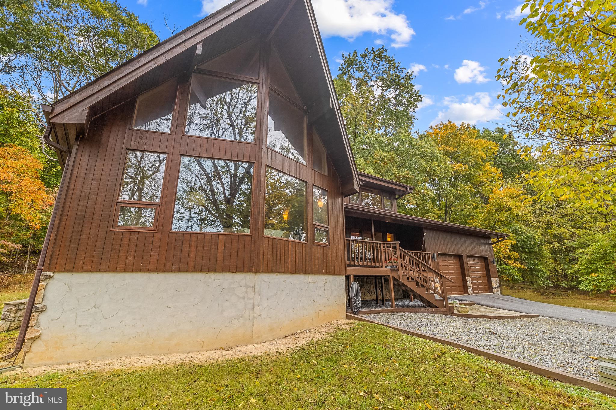 105 Rabbits Rest Lane Shepherdstown, WV 25443 - Photo 3 of 42 a front view of a house with a yard