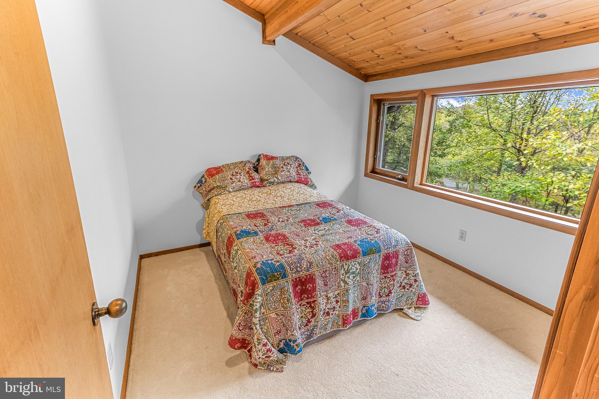 105 Rabbits Rest Lane Shepherdstown, WV 25443 - Photo 32 of 42 a bedroom with a bed and a window