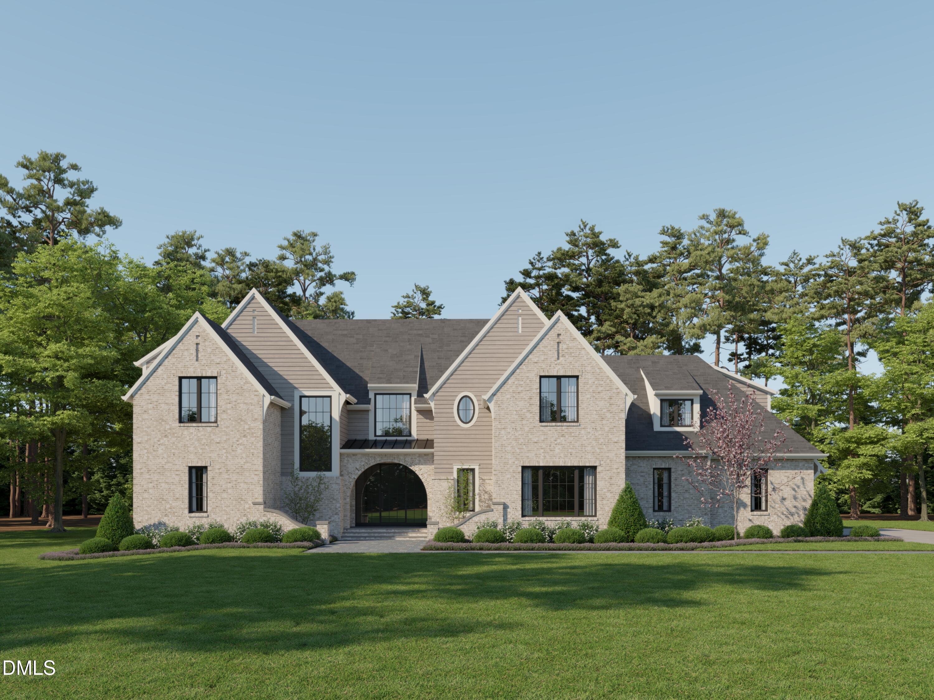 a front view of a white house with a yard