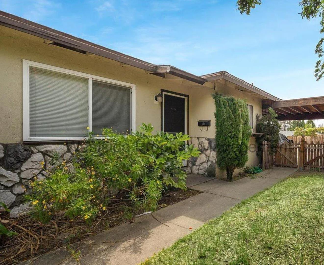 1542 Fall Avenue San Jose, CA 95127 - Photo 1 of 2 a front view of a house with garden