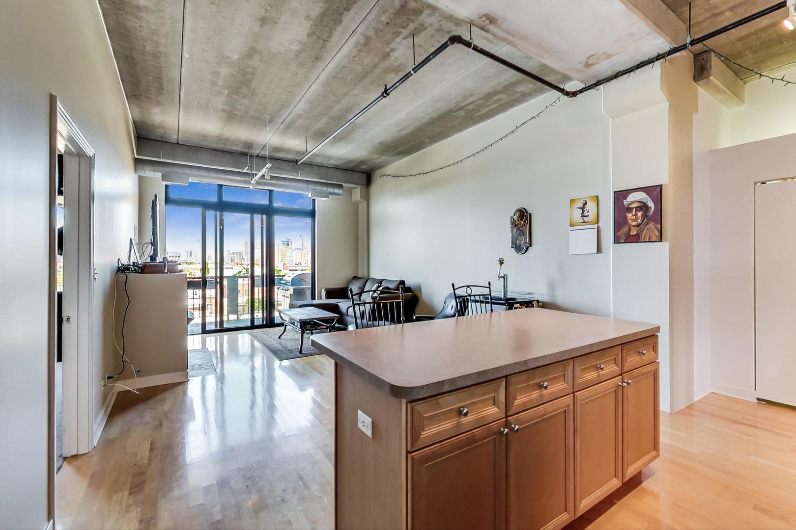 811 West 15th Place, Unit 606 Chicago, IL 60608 - Photo 8 of 22 a living room with stainless steel appliances granite countertop furniture and a refrigerator
